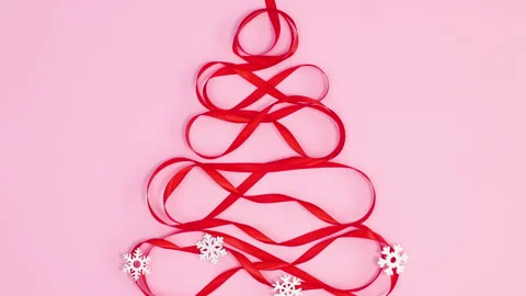 Making creative Christmas tree with red ribbon. Stop motion Stock Footage 162005391