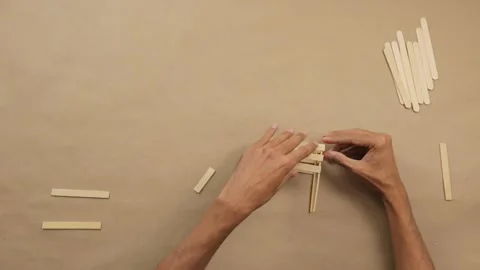 Making creative do it yourself crafts with glue and popsicle sticks 스톡 동영상 285540591