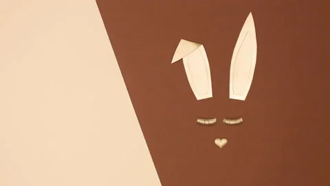 Making creative golden bunny with blinking eye lashes. Stop motion Stock Footage 150284176