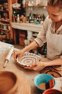 Making creative yet functional pieces. an unrecognizable artisan working in a Stock Photos