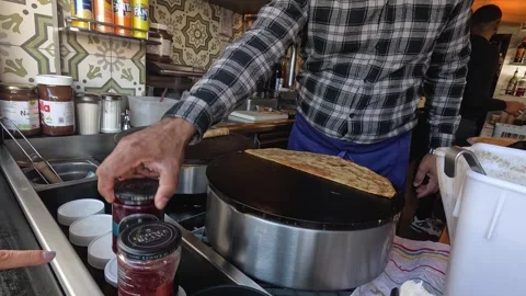 Making Crepes in Paris Cafe Stock Footage 297345288