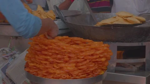 Making crispy crunchy Jalebi in small shop in varanasi Stock Footage 220765769