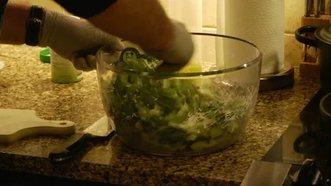 Making a cucumber salad Vídeos de archivo 143720045