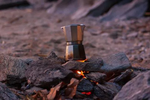 Making a cup of coffee on the beach. Stock Photos