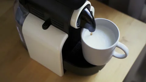 Making a cup of coffee with a milk foam, coffee machine Vídeo Stock 164658459