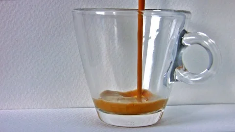 Making a cup of Espresso with coffee machine - Real Time Stock Footage 102168079