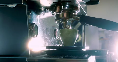 Making a cup of strong coffee in a coffee machine, the back light illuminates Stock Footage 237722556