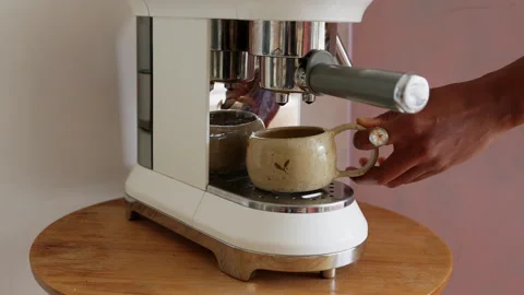Making a cup of strong coffee in a coffee machine Stock Footage 255033315