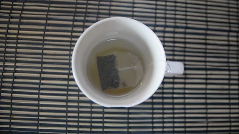 Making a cup of tea with a tea bag 스톡 동영상 95431532