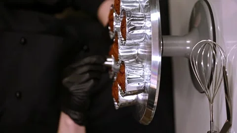 Making cupcakes, chef make a hole in muffins for filling, vertical video Stock Footage 297623896
