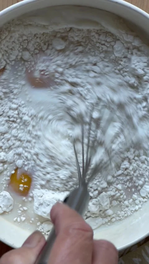 Making custard with eggs, milk and flour Stock Footage 242515967