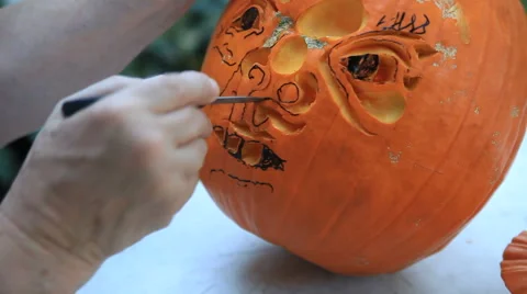 Making cuts to a pumpkin at Halloween Stock Footage 56660974