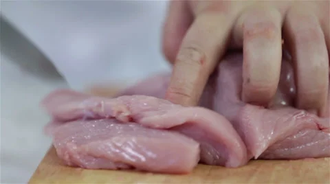 Making cuts of turkey steaks for dinner Stock Footage 30671250