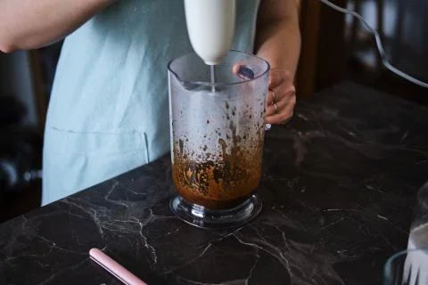 Making Dalgona Coffee at home, Preparing Homemade Dalgona Coffee Stock Photos