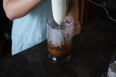 Making Dalgona Coffee at home, Preparing Homemade Dalgona Coffee Stock Photos