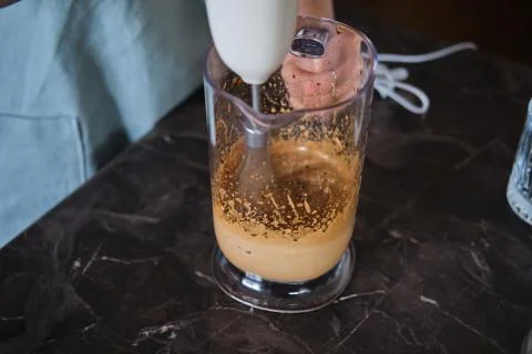 Making Dalgona Coffee at home, Preparing Homemade Dalgona Coffee Stock Photos