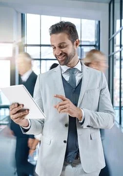 Making decisions at a click of a button. Shot of an attractive, smiling busin Stock Photos