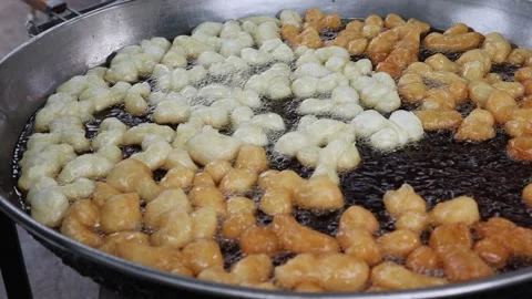 Making deep fried dough stick in metal pan and hot oil Stock Footage 141306556