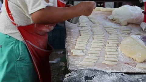 Making deep fried dough stick in metal pan and hot oil Stock Footage 141307212