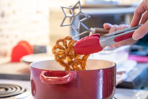 Making deep fried rosette cookies Stock Photos