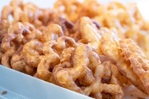 Making deep fried rosette cookies Stock Photos