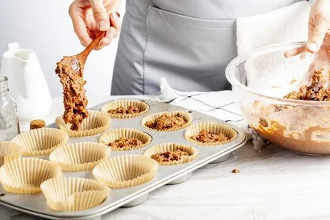 Making of delicious fruit and nut cupcake Stock Photos
