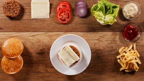 Making a delicious hamburger - assembling it from ingredients Stock Footage 82852946