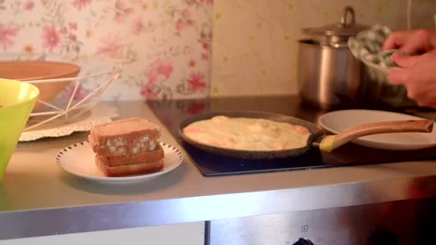 Making a Delicious Omelette with Bread on the Kitchen Counter Surface Stock Footage 318927282