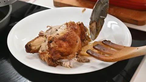 Making a delicious roast chicken. Serve it on a plate Stock Footage 217984102