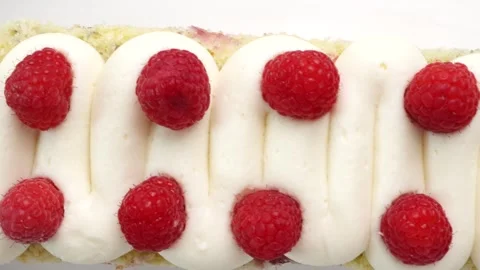 Making a dessert called Red Raspberry Tea Cake made with fresh berries and Stock Footage 313180291