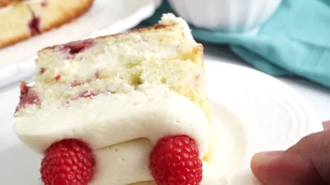 Making a dessert called Red Raspberry Tea Cake made with fresh berries and Stock Footage 313180293