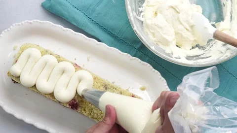 Making a dessert called Red Raspberry Tea Cake made with fresh berries and Stock Footage 313180297