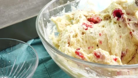 Making a dessert called Red Raspberry Tea Cake made with fresh berries and Stock Footage 313180310