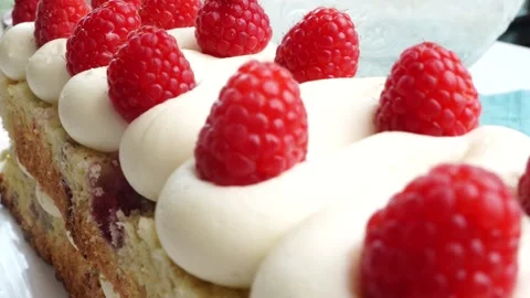 Making a dessert called Red Raspberry Tea Cake made with fresh berries and Stock Footage 313180315