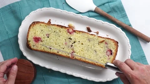 Making a dessert called Red Raspberry Tea Cake made with fresh berries and Stock Footage 313180329