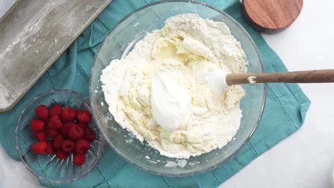 Making a dessert called Red Raspberry Tea Cake made with fresh berries and Stock Footage 313180337