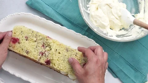 Making a dessert called Red Raspberry Tea Cake made with fresh berries and Stock Footage 313180342