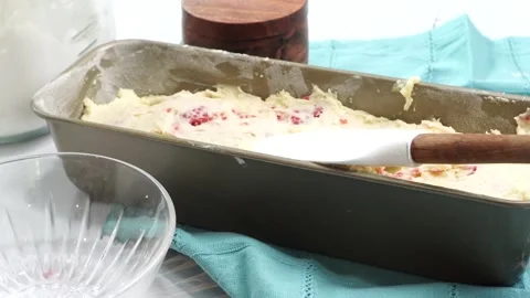 Making a dessert called Red Raspberry Tea Cake made with fresh berries and Stock Footage 313180355