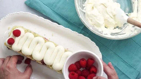 Making a dessert called Red Raspberry Tea Cake made with fresh berries and Stock Footage 313180358