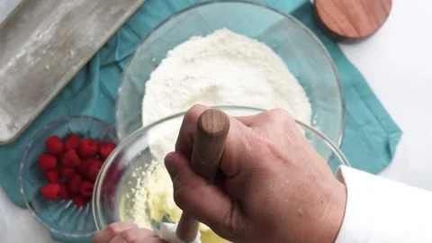 Making a dessert called Red Raspberry Tea Cake made with fresh berries and Stock Footage 313180369