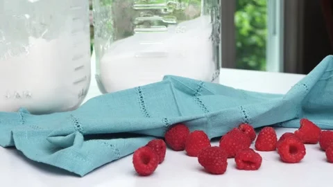 Making a dessert called Red Raspberry Tea Cake made with fresh berries and Stock Footage 313256745