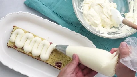 Making a dessert called Red Raspberry Tea Cake made with fresh berries and Stock Footage 313256750