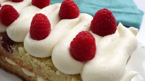 Making a dessert called Red Raspberry Tea Cake made with fresh berries and Stock Footage 313256764
