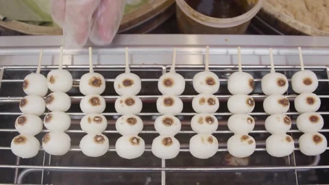 Making Dessert Mitarashi Dango Stick on Hot Stove Stock Footage 153581003