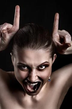 Making devil horns Фото