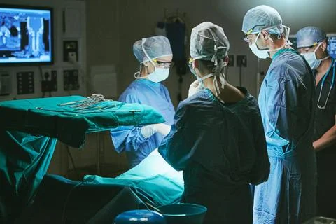 Making a difference in the lives of their patients. surgeons in an operating Stock Photos