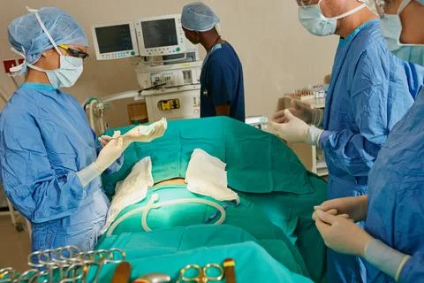 Making a difference in the lives of their patients. a team of surgeons preparing Stock Photos