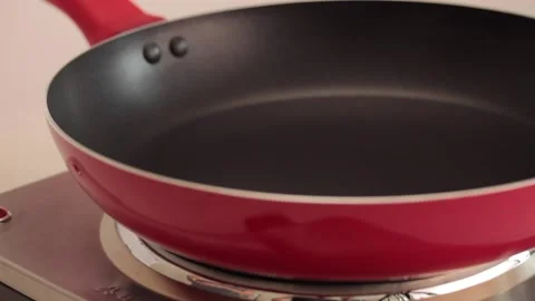 Making different figures in a cooking pan with scrambled eggs for a omelette Stock Footage 133814130