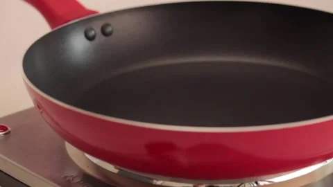 Making different figures in a cooking pan with scrambled eggs for a omelette Stock Footage 133814472