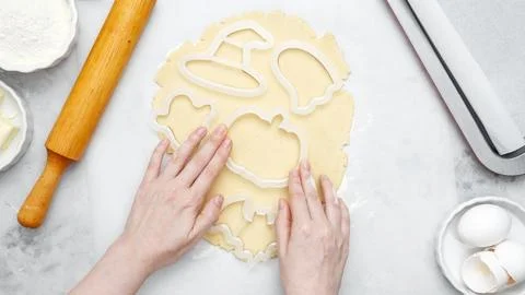Making different shapes of fall cookies for Halloween. Dough with cookie cutt Stock Photos